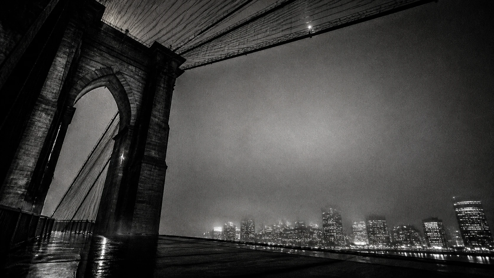 Grainy nighttime view of the Brooklyn Bridge and Manhattan